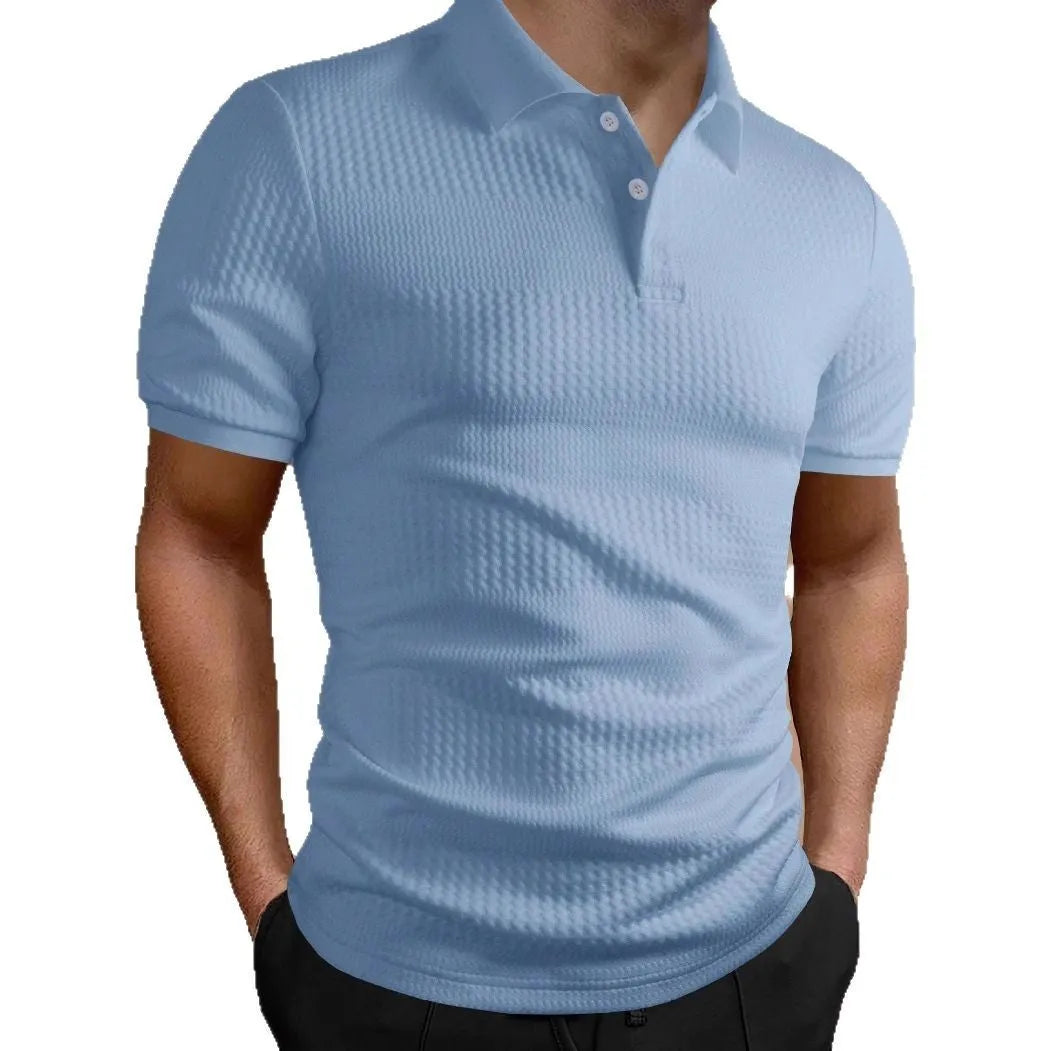 Man wearing a striped loose-fit polo shirt in light blue, showing short sleeves and asymmetric detail.