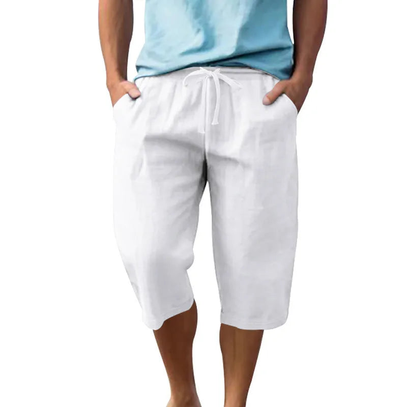 Men's loose fit linen shorts in a solid colour with a high waist and drawstring closure.
