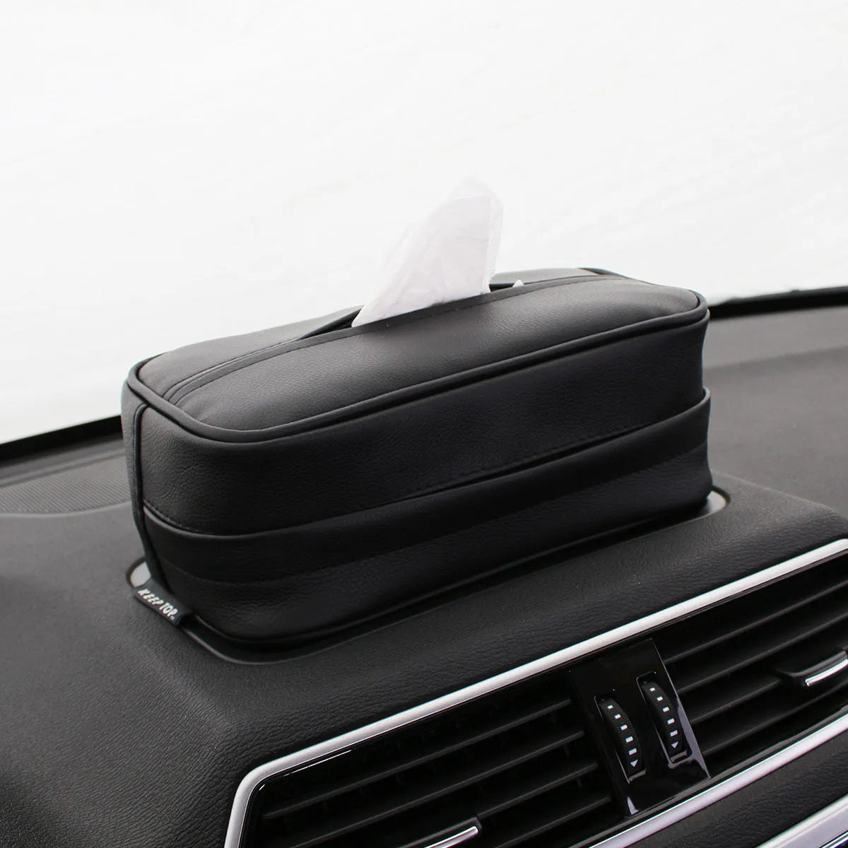Black PU leather hanging storage box organiser with handle, shown next to a beige medium size model.