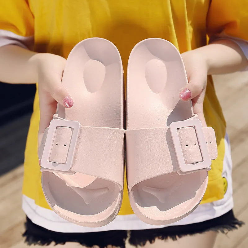 Women's grey blue EVA buckle slipper sandals on a white background.