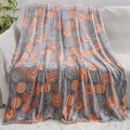 Children's flannel blanket with cartoon designs in red and blue colours