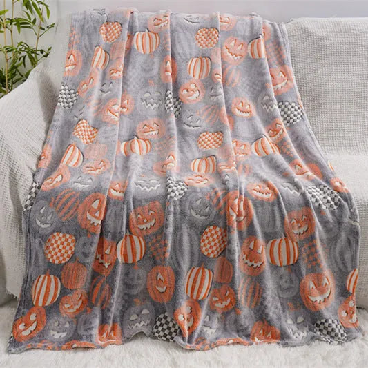 Children's flannel blanket with cartoon designs in red and blue colours