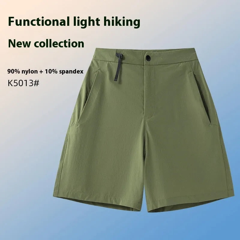 Men's quick-drying sports shorts in khaki colour with 3D cut and elastic waistband on a plain background.