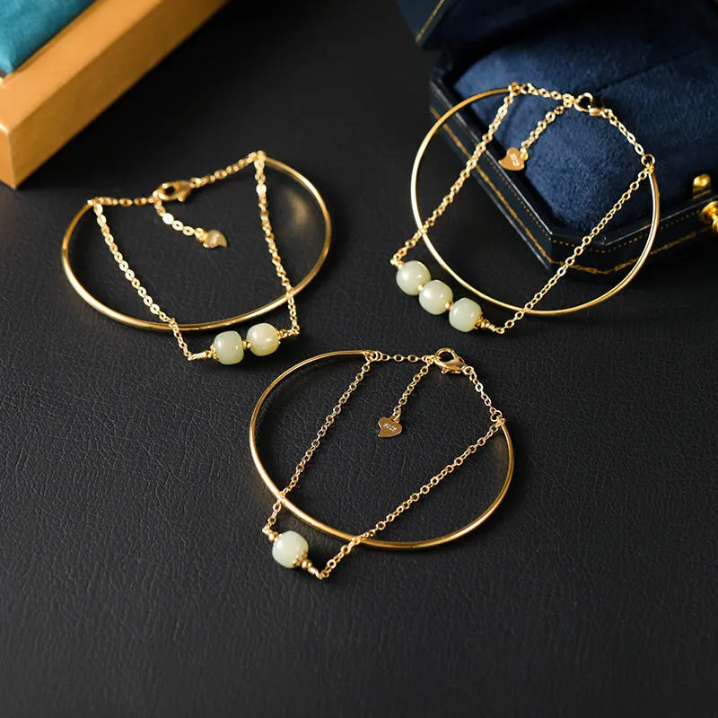 Women's Hetian jade lucky bracelet with gold inlay in single, double, and three bead styles.