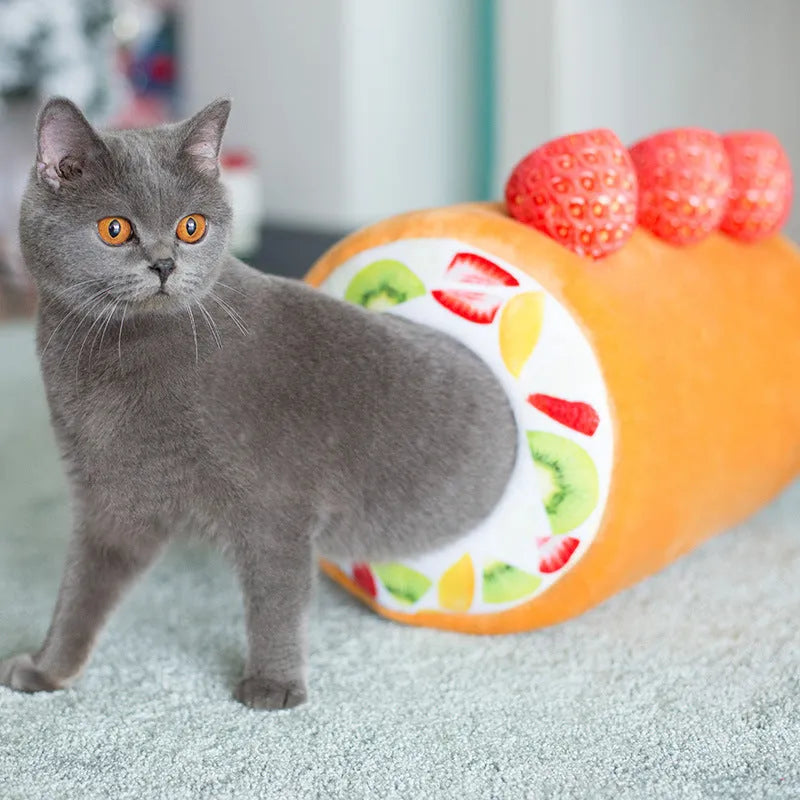 Yellow cake roll plush cat toy 40cm long on plain background