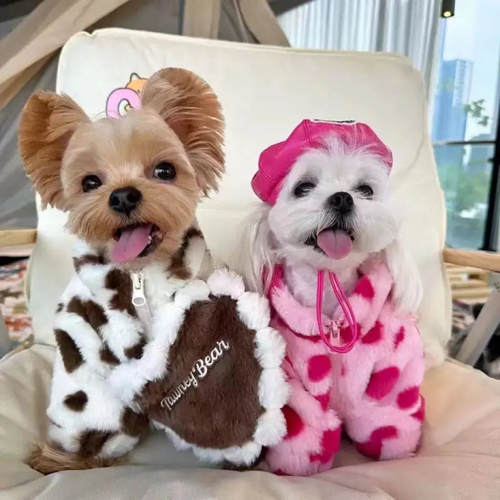 Small dog wearing plush warm coat in pink colour for cold weather protection
