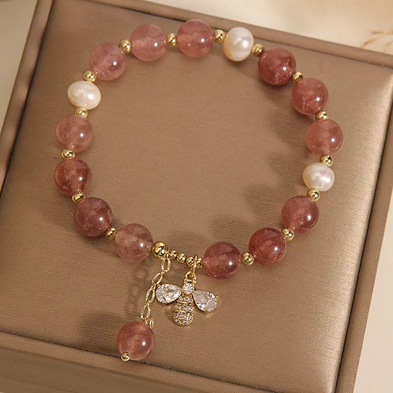 Women's strawberry quartz and freshwater pearl bracelet with zircon details in alloy setting