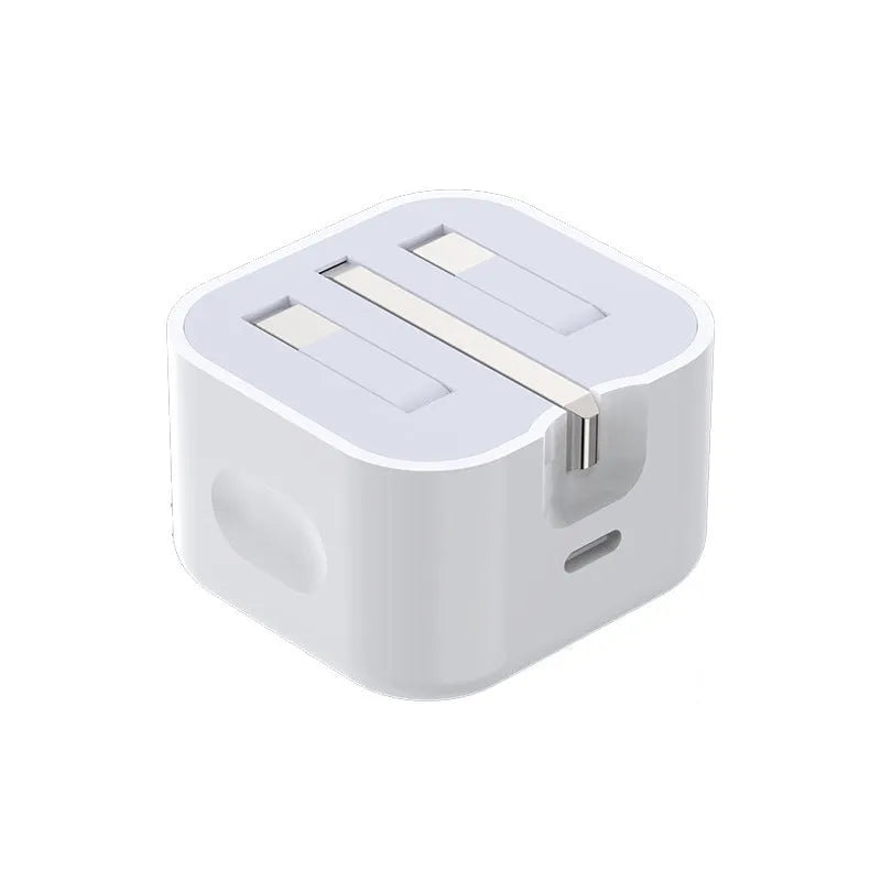 White 20W USB-C PD fast charger with UK plug and a coiled charging cable.