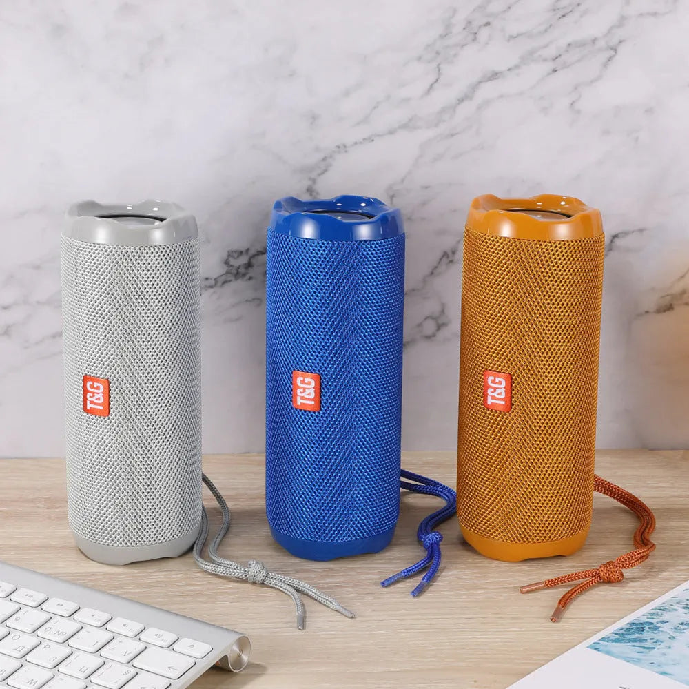 Portable fabric-cased Bluetooth speaker with card holder in multiple colour options.