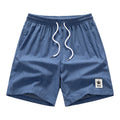 Men's black drawstring summer shorts with straight leg on a mannequin