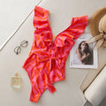 Women's printed one-piece swimsuit with double shoulder straps and a deep V neckline