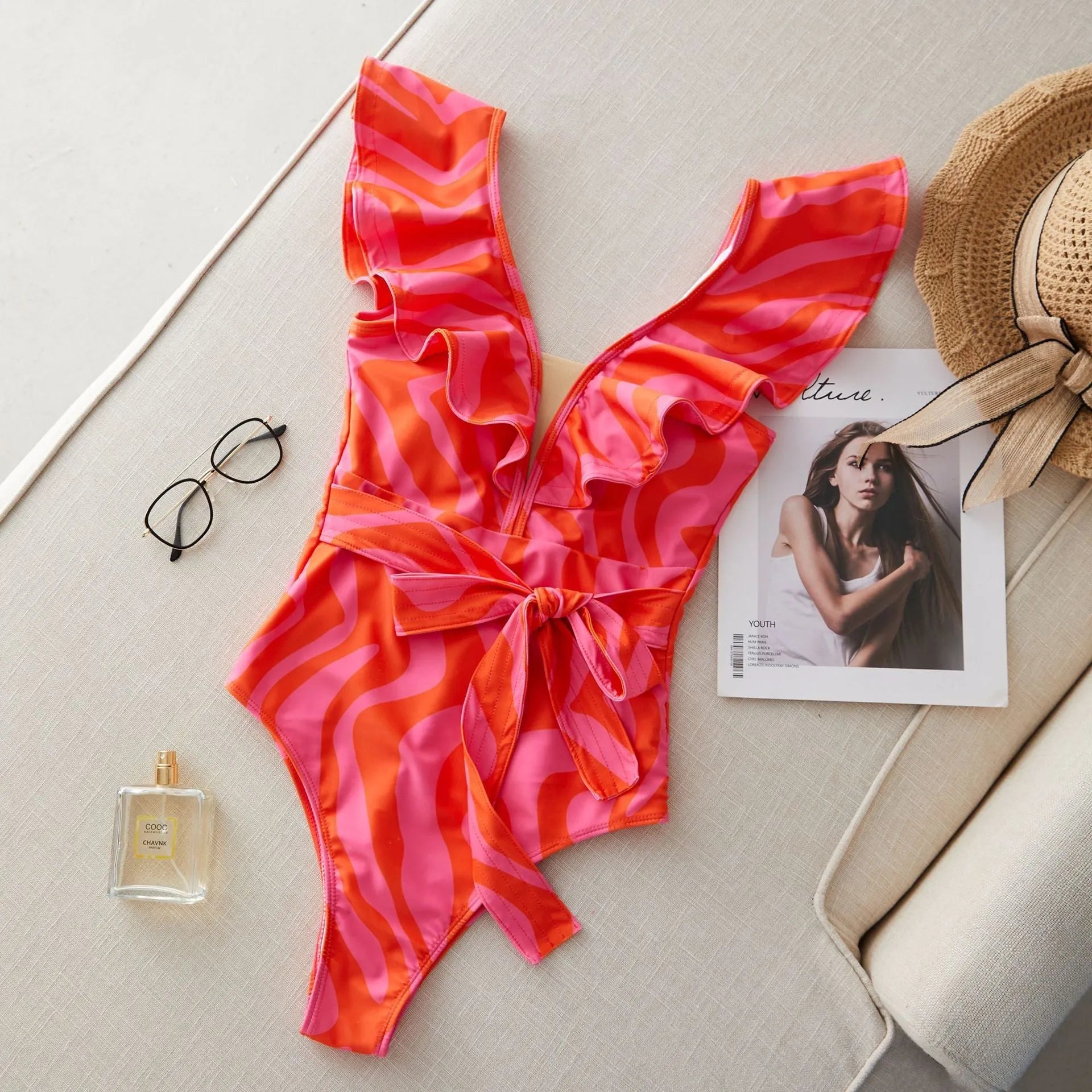 Women's printed one-piece swimsuit with double shoulder straps and a deep V neckline
