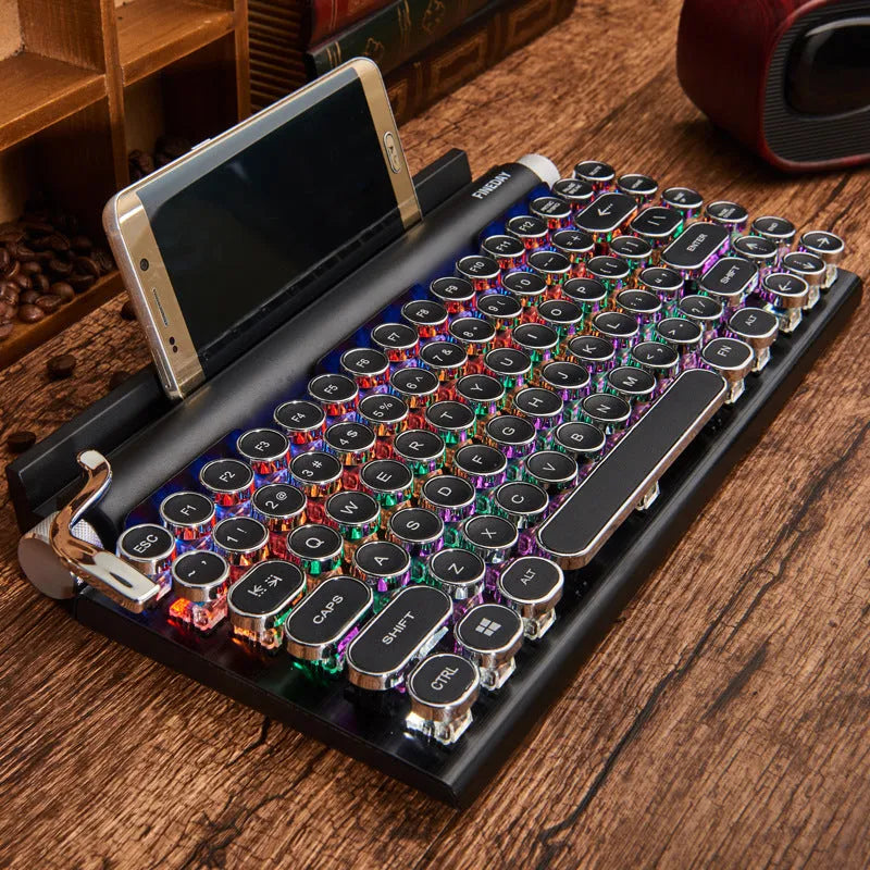 Black retro-style mechanical keyboard with colourful backlit keys on a desk.