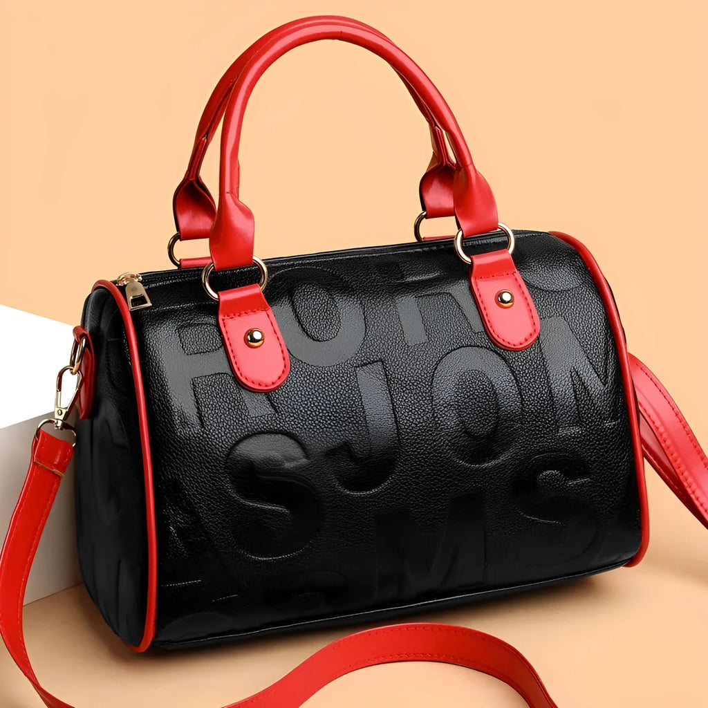 Cylindrical brown PU crossbody bag with three shoulder straps showing textured interior lining
