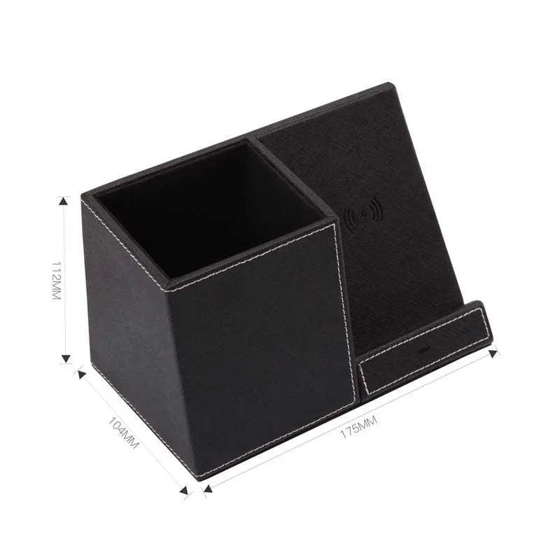 Black leather pen holder with integrated wireless phone charging pad on a desk