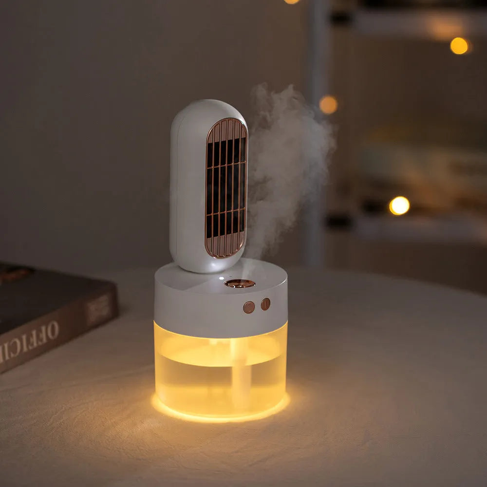 Small black and white portable humidifier fan with oscillating head on desk