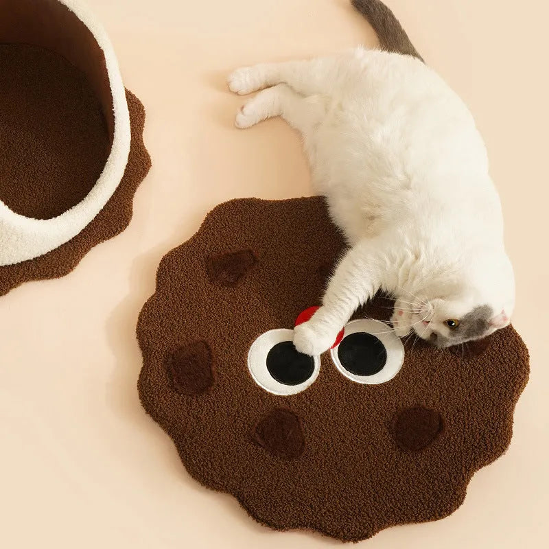 Khaki coloured enclosed cat house shaped like sandwich cookie with removable cushion for winter sleeping