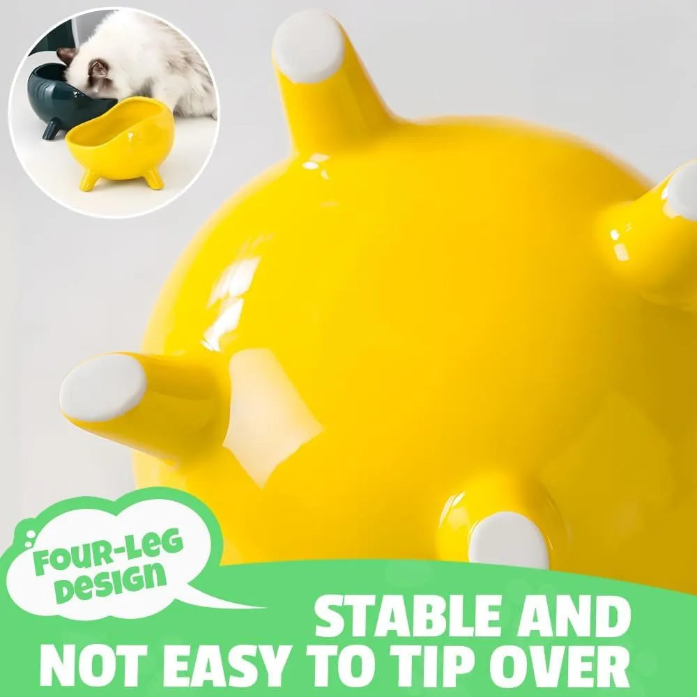 Green ceramic pet bowl with four legs and a rounded rim for stability and spill control.
