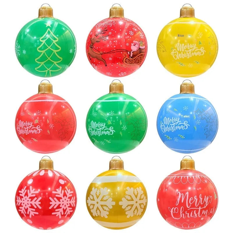 63cm red inflatable Christmas ball with LED lights in outdoor garden setting