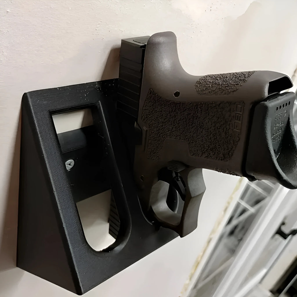 Black plastic punk-style pistol display stand for toy guns and replicas.