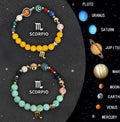 Set of two natural stone beaded bracelets for Zodiac signs on a textured background.