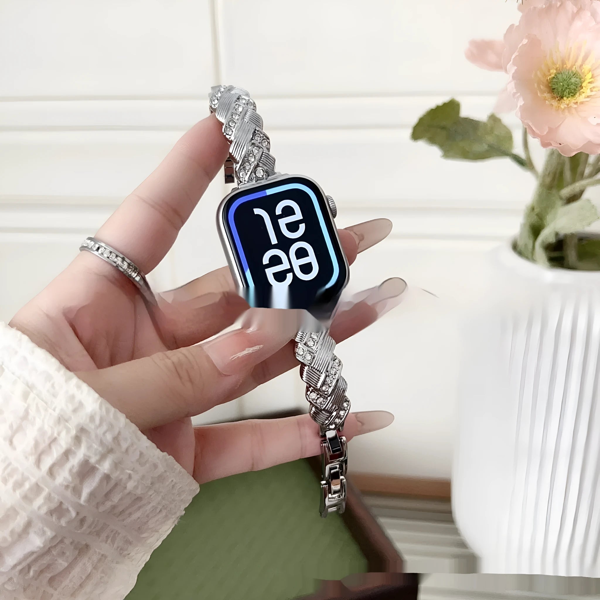 Zinc alloy metal watch strap for iPhone in silver, rose gold, gold, black, and starlight colour options on a grey background.