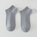 Solid colour low-cut polyester boat socks for men in a free size, shown in one of six available colour options.