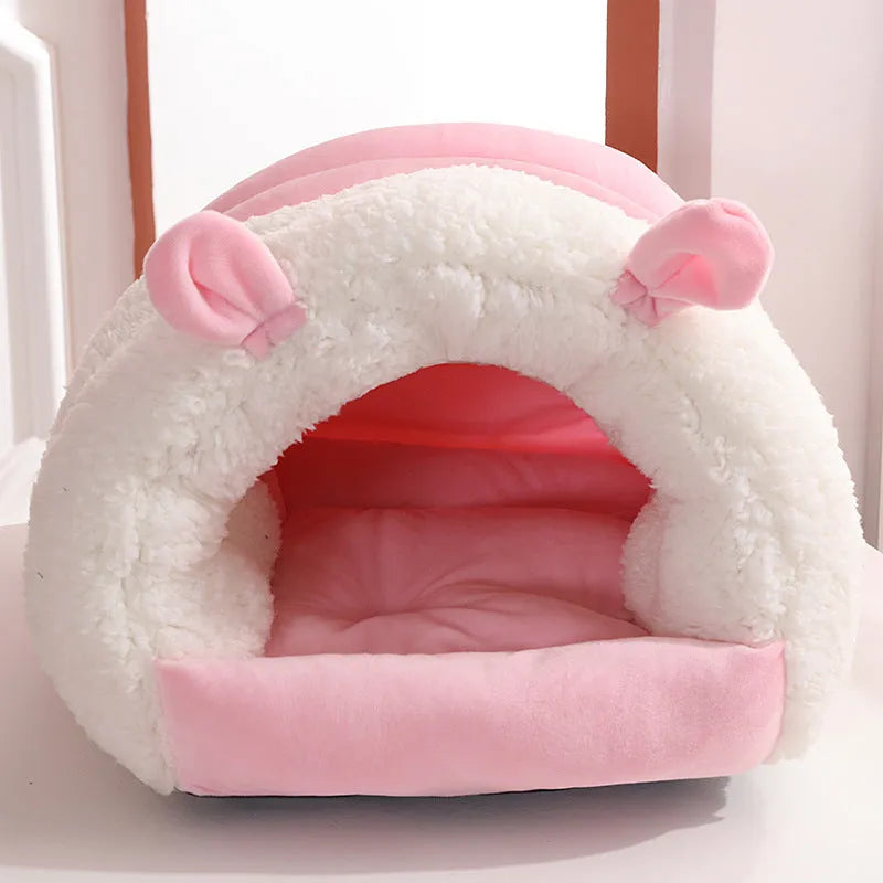 Blue enclosed cat nest with fluffy fleece interior, shown with a removable washable cover.