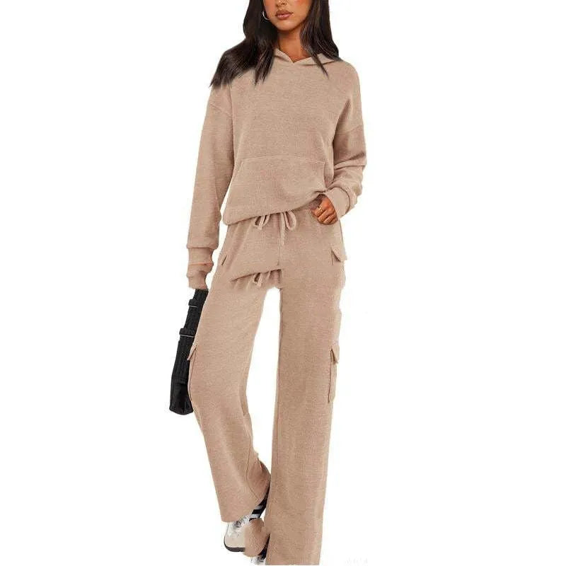 Women's black leisure sports suit set featuring a long sleeve top and full-length trousers made from polyester.