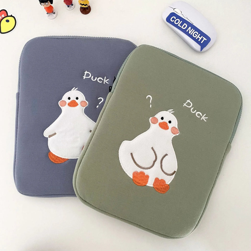 Blue cotton tablet case with embroidered cartoon duck design and zipper closure.