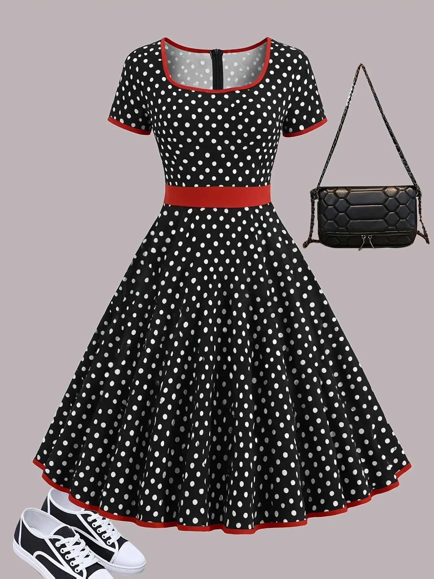 Women's multicolour polka dot pleated dress with a square collar, short sleeves, and a front zip fastener.
