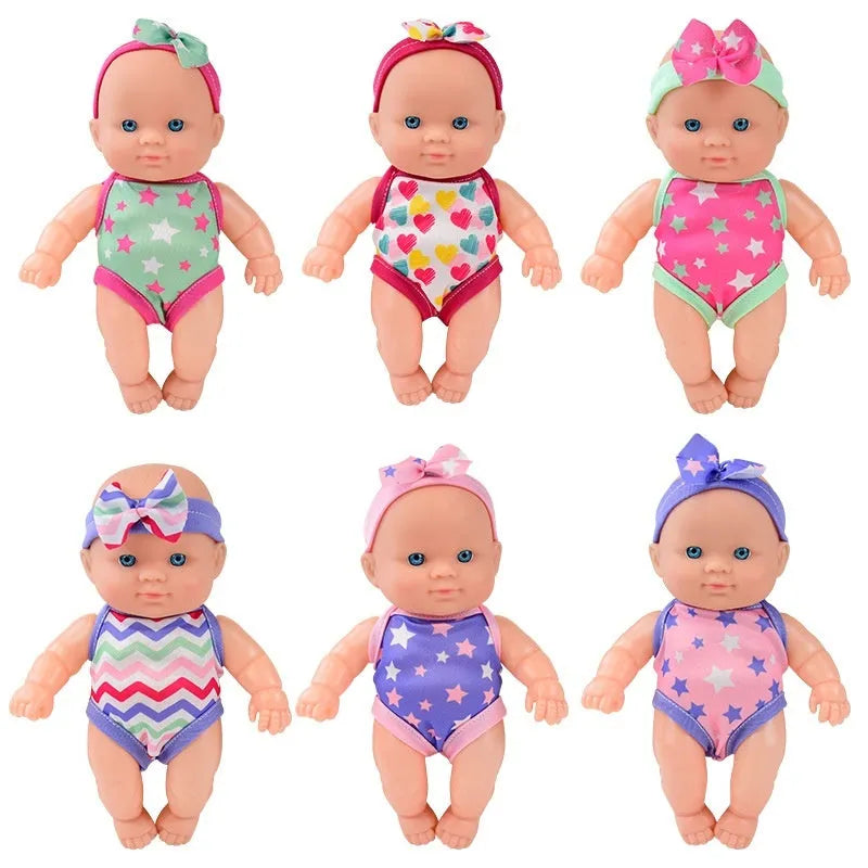 21.5 cm tall simulation baby vinyl doll figurine on display.