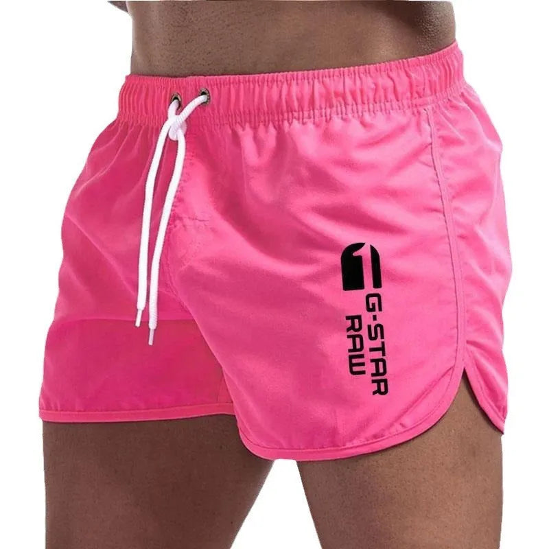 Man wearing thin polyester hemp blend beach shorts in fluorescent green, suitable for sports.