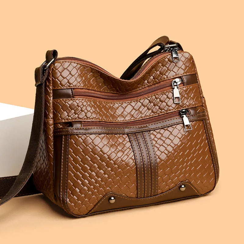 Woven single shoulder messenger bag in horizontal square shape with multiple compartments and PU leather construction