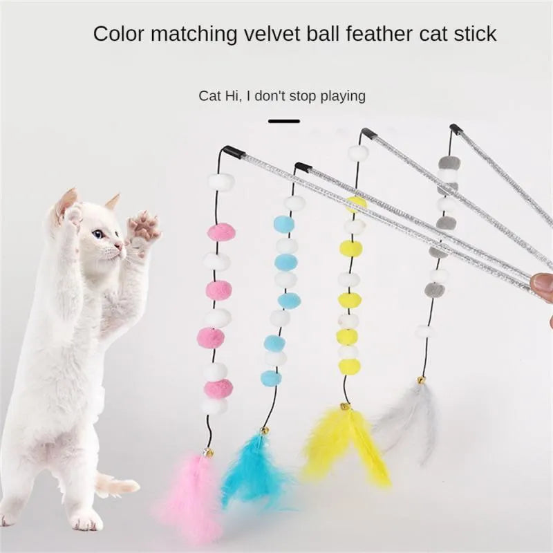 Grey, yellow, and blue acrylic pompon cat teaser stick with feather and bell, shown at 31cm length.
