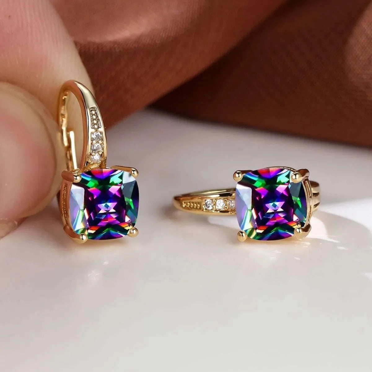 Geometric square ear clip with colourful moissanite inlay on electroplated copper background