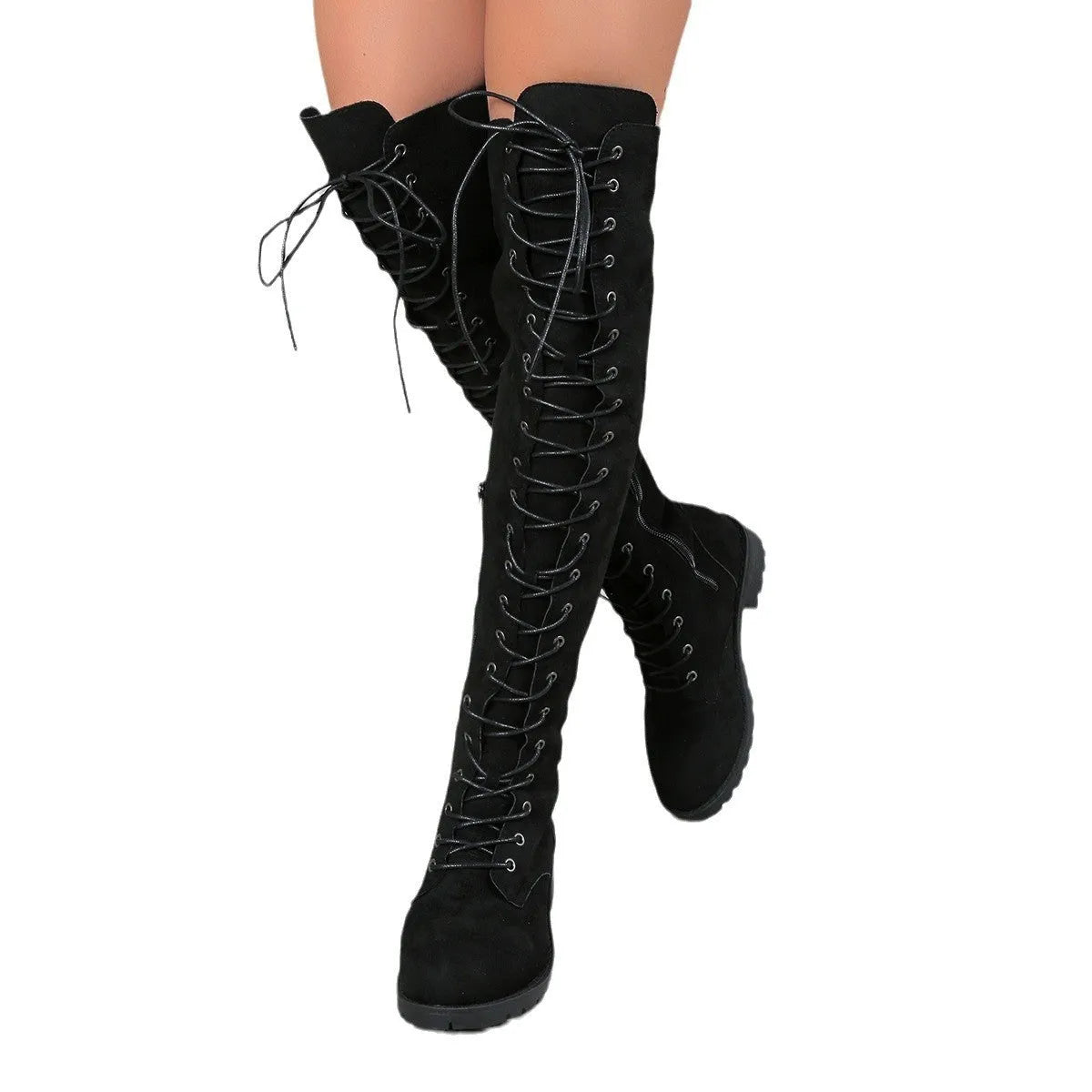 Black lace-up over the knee boots with a round toe and flat rubber sole on a plain background.