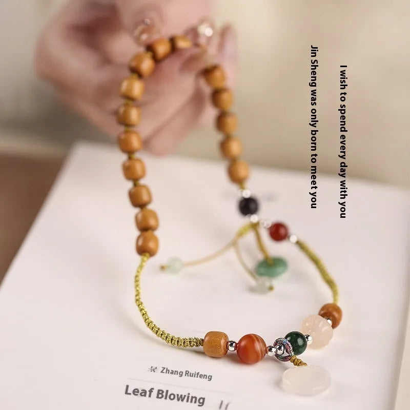 Hand-woven ebony double ring bracelet with ruyi elements in jade or chalcedony colour options