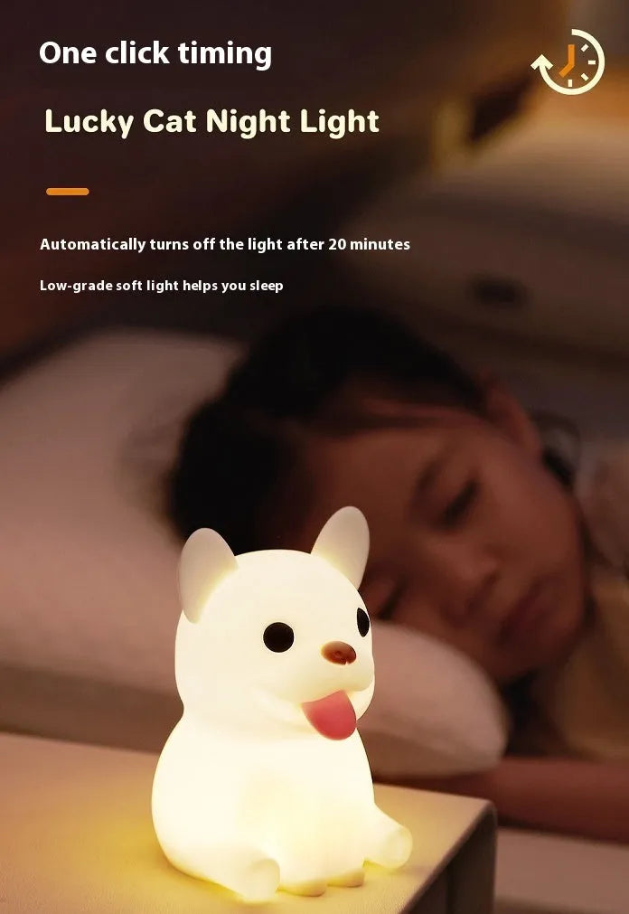 Silicone animal-shaped USB night light with touch dimming on a bedside table.