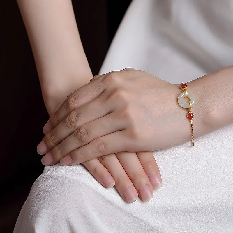 Gold-plated sterling silver bracelet with natural Hetian jade stone and peace buckle closure
