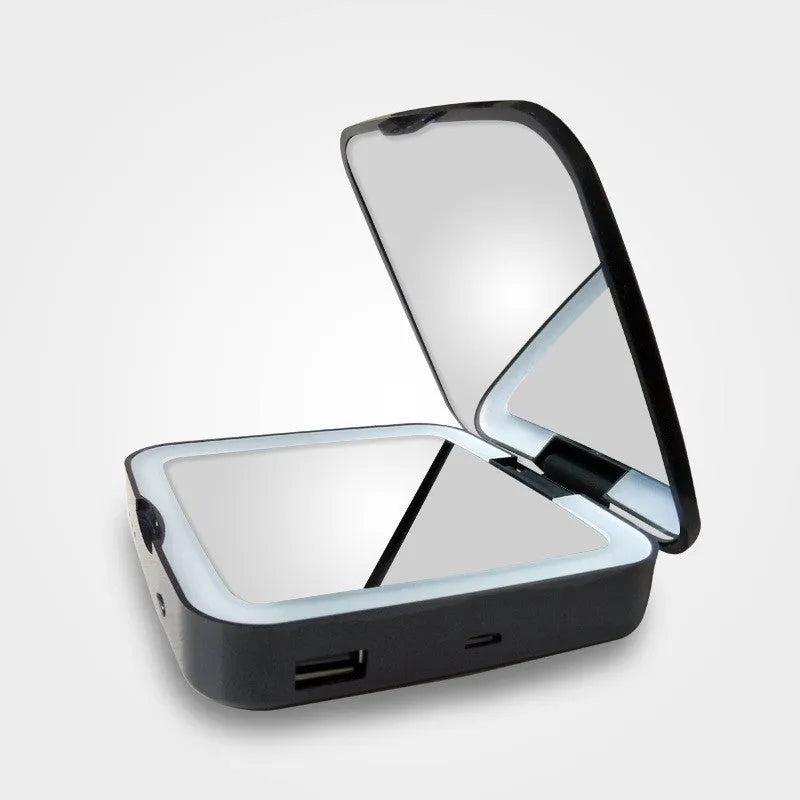 Black and white lighted makeup mirror with 4x magnification panel, HD mirror, and adjustable LED lights.