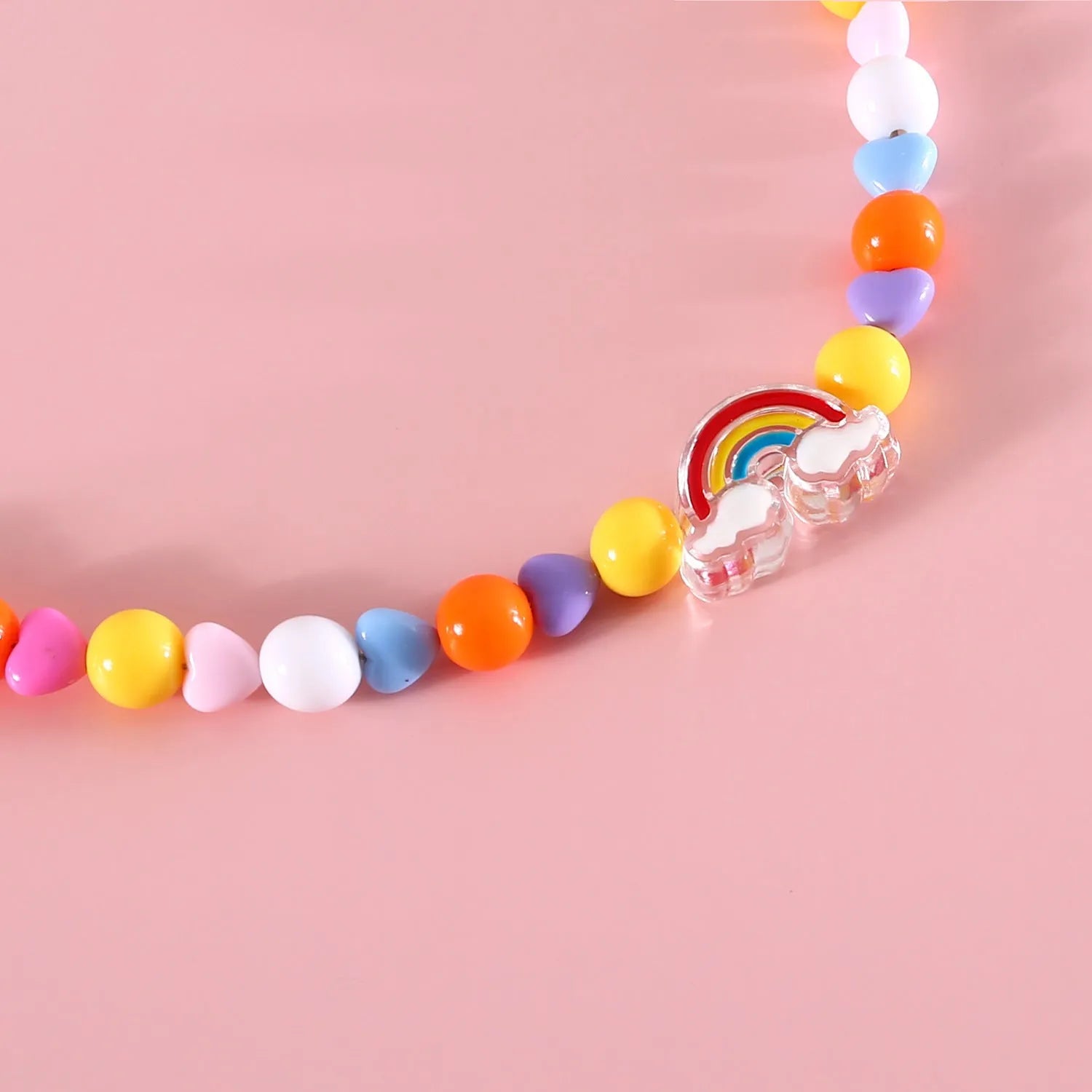Colourful plastic cat necklace with bead patterns in rainbow, peach or small flower designs on adjustable 15-35cm collar