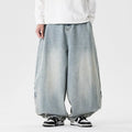 Men's plus size light blue baggy wide-leg jeans on a hanger, showing straight leg and low waist.
