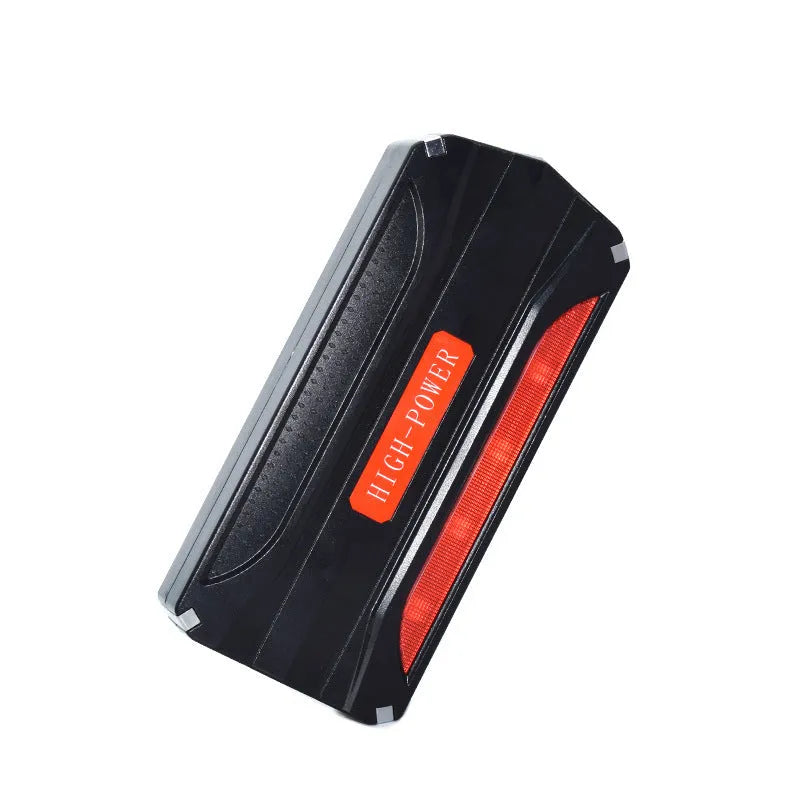 Black and red 12V vehicle emergency jump starter power supply unit.