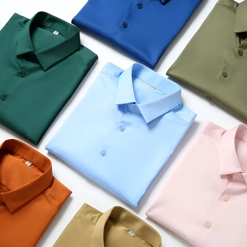 Man wearing a solid colour long-sleeved non-ironing shirt made from elastic polyester spandex fabric.