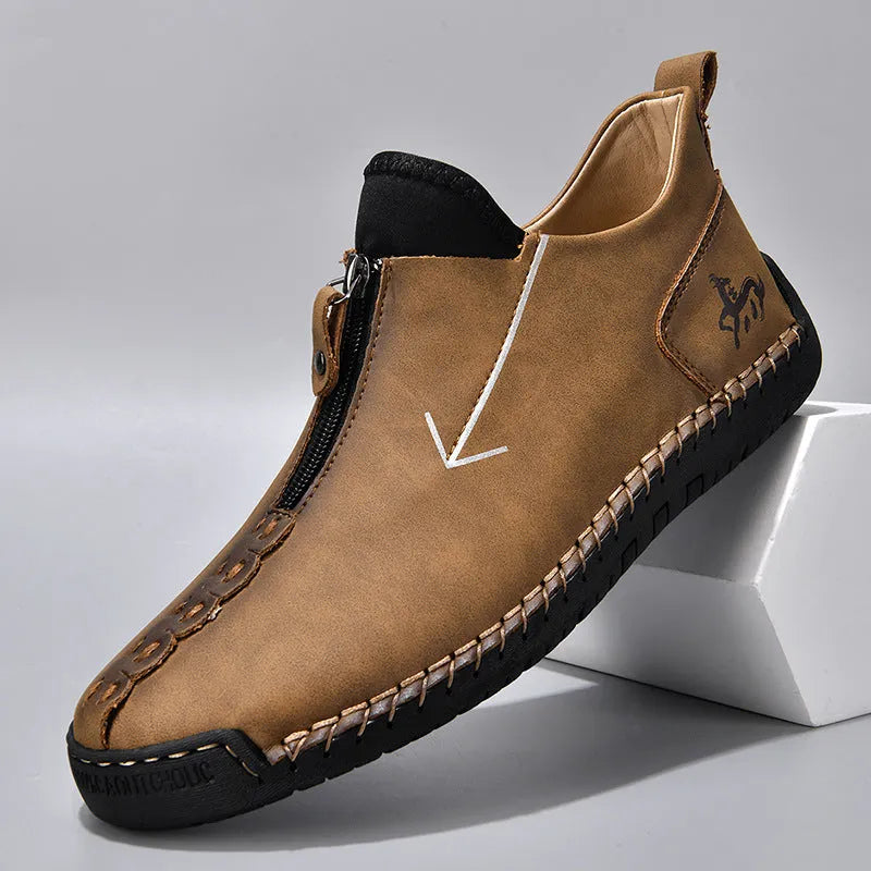Men's black front zip Martin boots with hand-stitching on artificial PU upper and rubber sole.