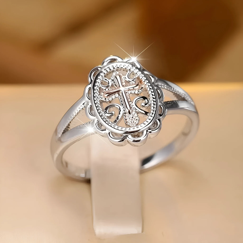 Women's silver cross lace ring showing detailed patterning and electroplated finish