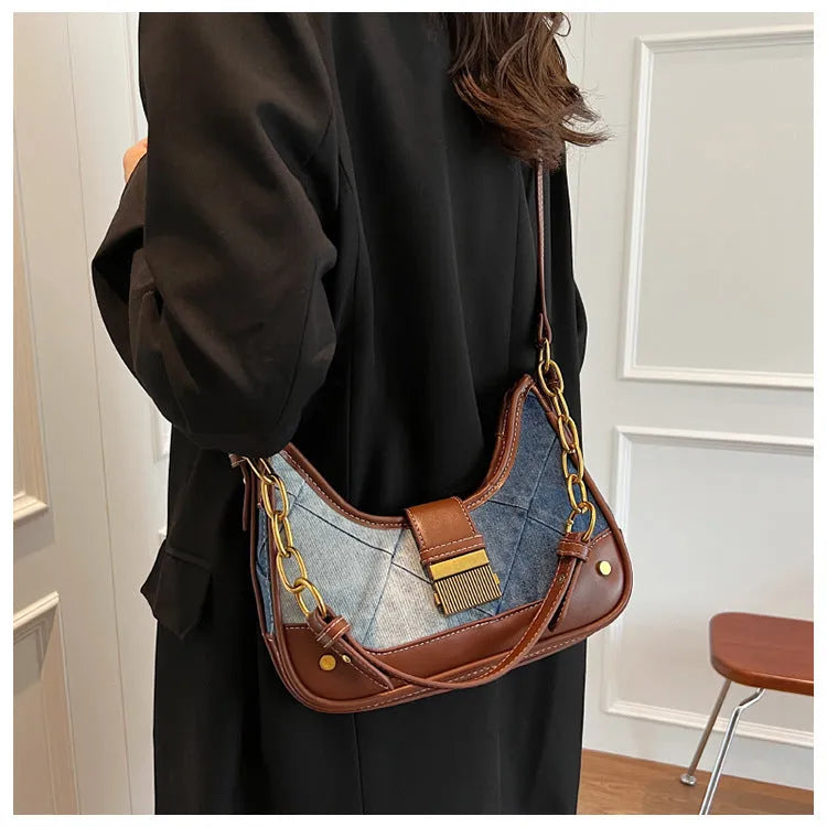 Brown denim women's bucket shoulder bag with diamond mesh, chain detail, and double straps.