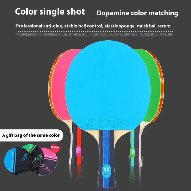 Blue, green, and pink shakehand grip table tennis rackets with matching racket covers laid out.
