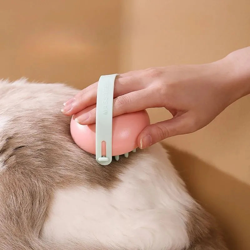 Blue silicone pet bathing brush with soft nubs for massaging and cleaning cats or dogs.